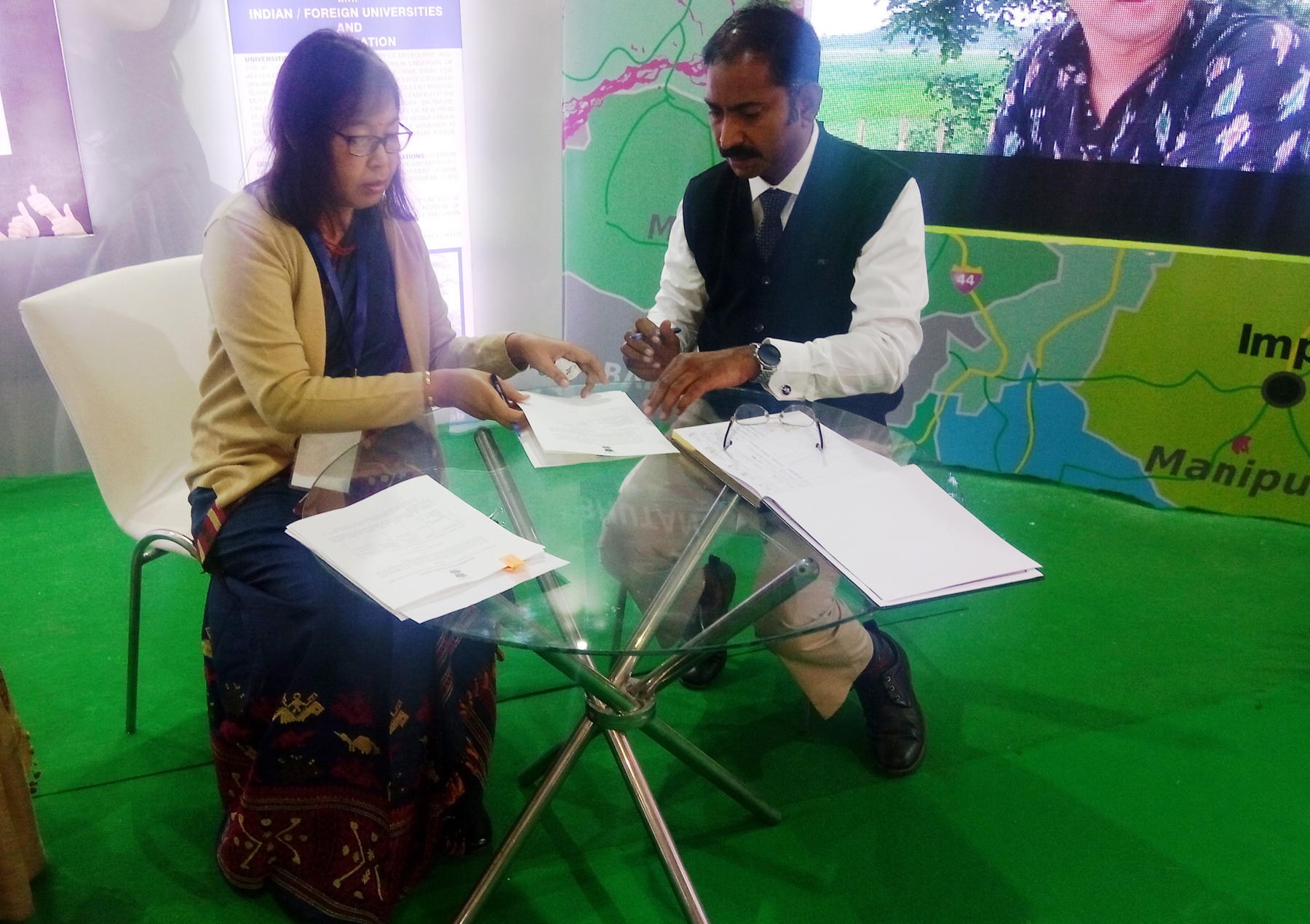 Smti Krishna Gohain (IAS Secretary, Higher Education Department, Assam) and Mr. Amitab Saxena (Director, AISECT) signing the MoU for setting up Dr. V. Raman University in the State